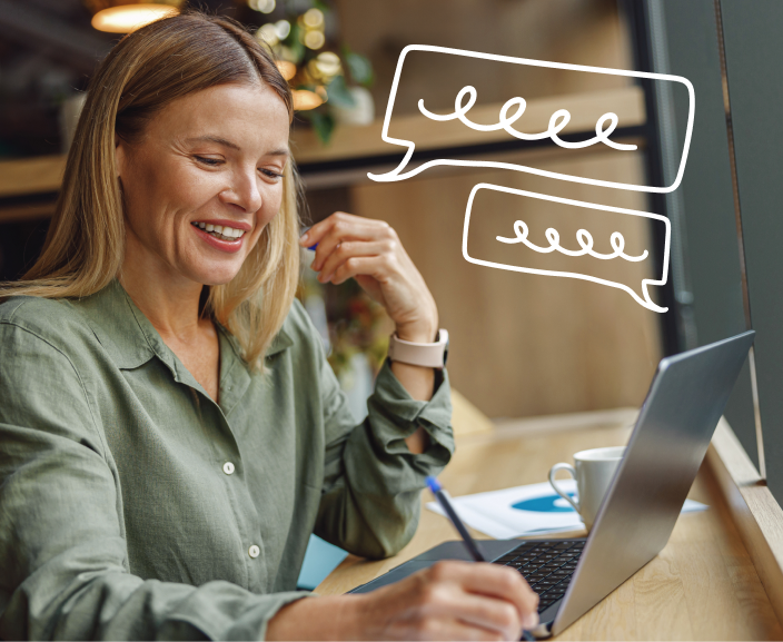 Woman smiling while using laptop with animated speech bubbles indicating online conversation or chat