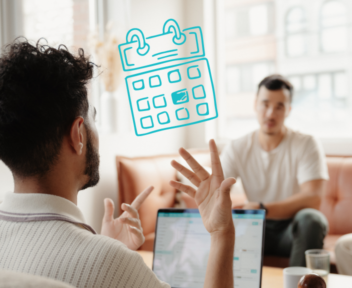 Man gesturing while discussing scheduling with colleague, with calendar icon overlay representing appointment planning