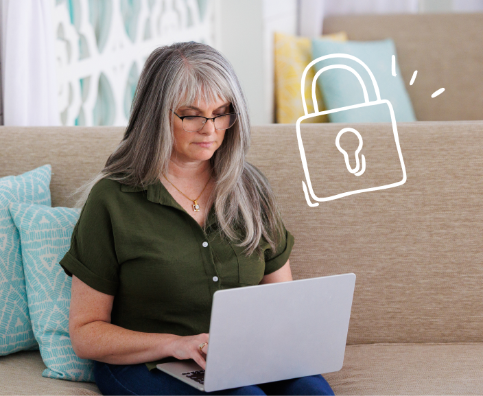 Woman using laptop on couch with security lock icon overlay